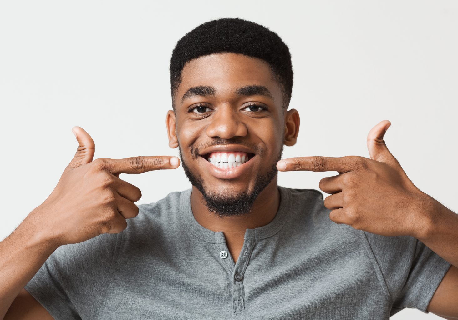African American Man Smiling And Showing Perfect Teeth